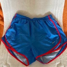 Womens Nike Run Shorts. Blue W/Red Piping And Red “Run” On Back. Too Cute! New, Never Worn Nike Blue Shorts, Nike Red Workout Shorts, Nike Blue Running Shorts, Nike Blue Athletic Shorts With Built-in Shorts, Nike Blue Activewear With Built-in Shorts, Fashion Fairytale, Track Star, Run Shorts, Running Shorts Women