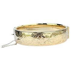 This gorgeous metal core bangle has wonderful engraving and is coated in 9ct gold. Inner diameter widest point: 6.1cm Inner circumference: 17.2cm Bangle Width: 16mm Weight: 31g Luxury Antique Etched Bangle, Engraved Bangle, Metal Core, Yellow Gold Engagement Rings, Antique Metal, Gold Engagement, Bangle Bracelets, Jewelry Bracelets, Bangles