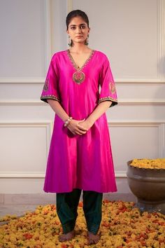 Hot pink kurta featuring zari hand embroidered neckline and sleeves. Paired with a bottle green salwar. - Aza Fashions Straight Kurta With Embroidered Border For Reception, Pink Kurta For Ceremonial Festive Occasions, Anarkali Kurta With Embroidered Border For Ceremonial Occasions, Pink Traditional Wear With Embroidered Border In Cotton Silk, Pink Kurta With Embroidered Border For Diwali, Pink Embroidered Kurta For Diwali, Pink Cotton Silk Kurta With Embroidered Border, Pink Floor-length Kurta With Resham Embroidery, Pink Semi-stitched Handwork Kurta