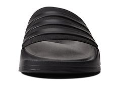 Get yourself the trendy adidas® Adilette Shower slippers..Synthetic upper, lining and insole..adidas® logo on toe strap..Slip-on closure..Synthetic outsole..Imported..Product measurements were taken using size Men's 10, Women's 11, width Medium. Please note that measurements may vary by size..Measurements: Weight: 4 oz Sporty Adidas Slides Suitable For Water, Sporty Adidas Slides For Swimming, Adidas Slides For Swimming With Synthetic Material, Adidas Logo Synthetic Slides For Swimming, Sporty Adidas Slides For Beach, Adidas Slides For Swimming With Logo, Adidas Slides With Logo For Swimming, Casual Adidas Slides For Swimming, Synthetic Slides For Summer Training