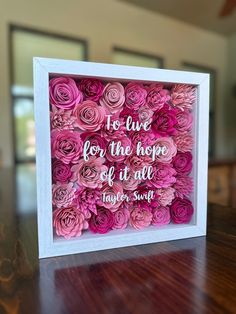 pink flowers in a white frame with the words to live for the hope of all together