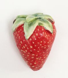 a close up of a strawberry on a white background