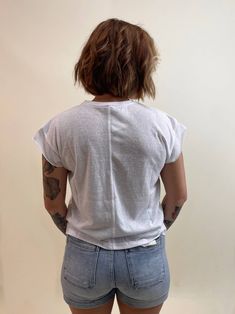 This white Back Seam Tee is a must-have for any casual wardrobe. Designed with a relaxed fit, it features a unique back seam detail and raw hem short sleeves. Stay comfortable and stylish in this basic yet trendy piece. 100% Cotton Hand wash cold/Line dry Recommended sizing: S(2-4) M(6-8) L(10-12) Casual T-shirt With Shirttail Hem For Everyday, White Casual T-shirt With Shirttail Hem, Casual White T-shirt With Shirttail Hem, Basic Short Sleeve Top With Shirttail Hem For Everyday, Relaxed Soft-washed Top With Shirttail Hem, Relaxed Fit Short Sleeve T-shirt With Frayed Hem, Relaxed Fit T-shirt With Frayed Hem, Relaxed Fit Short Sleeve Top, Everyday Relaxed Fit Tops With Shirttail Hem