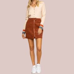 This corduroy mini skirt is a perfect match for a walk. Features high waist fit and an exposed front zipper with big patch pockets. High-Waisted Fit A-Line Short Length Button Closure Exposed Front Zipper Front Patch Pockets Back Welt Pockets Soft Corduroy Unlined 100% Cotton Hand Wash Cold, Lay Flat to Dry Imported Small: Length 17" Waist: 27" Medium: Length 17.5" Waist 29" Large: Length 18" Waist 31" . Corduroy Mini Skirt, A Line Shorts, Jumpsuits And Romper, A Walk, Welt Pocket, Medium Length, Perfect Match, Front Zipper, Patch Pocket