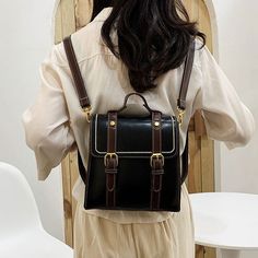 Faux leather boxy satchel bag with adjustable buckle and detachable straps that allows it to be carried as a backpack or crossbody shoulder bag. Magnetic closure with zip up main compartment. 21cm x 21cm x 10cm 8.26" x 8.26" x 3.93" Book School, Soft Leather Backpack, Travel Rucksack, Tas Fashion, Leather Book, Comfortable Slippers, Vintage Shoulder Bag, Leather Books, Flip Flop Shoes