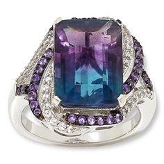 Colleen Lopez Sterling Silver Bi-Color Fluorite and Multigem Ring  Flaunt your unique style when you accessorize with this captivating ring design. The sterling silver piece features a natural, bi-color fluorite stone surrounded by complementary purple amethyst and the diamond-like sparkle of white zircons. The result is an elegant, distinctive piece you'll be wearing for many years to come!       Approx. 7/16"L x 7/16"W; shank 3/16"W     Stamped .925     Ring has emerald-cut, bi-color fluorite stone prong set in center of swirl design     Swirl-style frame and split shoulders lined with round white zircons and purple amethyst stones     Finished undergallery   Stone Information       All sizes and weights approximate     Total Carat Weight: 9.04ct     Bi-Color (Green/Purple) Fluorite - Em Elegant Multicolor Amethyst Ring With Accent Stones, Elegant Multicolor Amethyst Ring With Gemstone Accents, Elegant Multicolor Amethyst Gemstone Ring, Multicolor Ring For Formal Occasions, Multicolor Amethyst Ring With Gemstone Accents, Fine Jewelry With Multicolor Emerald Cut, Multicolor Amethyst Rings With Accent Stones, Multicolor Gemstone Accented Ring, Multicolor Fusion Style Jewelry With Accent Stones