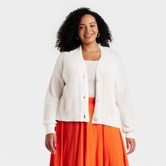 This Button-Up Cardigan from Universal Thread™ adds a chic staple to your cool-weather wardrobe. Designed in a classic shaker-knit pattern with ribbed edges, this long-sleeve cardigan is made from midweight cotton for comfortable wear. It's tailored in a casual fit with a long-length silhouette and features a flattering deep V-neckline and a full-length button-down placket that can be worn buttoned or unbuttoned. Universal Thread™: Found exclusively at Target. Ribbed Knit Button-up Outerwear, Fall Ribbed Button-up Cardigan, Ribbed Button-up Fall Outerwear, Ribbed Button-up Outerwear For Fall, Ribbed Button-up Outerwear For Layering, Spring Sweater With Button Closure And Relaxed Fit, Spring Ribbed Button-up Outerwear, Casual Ribbed Cardigan With Relaxed Fit, Casual Ribbed Cardigan For Daywear