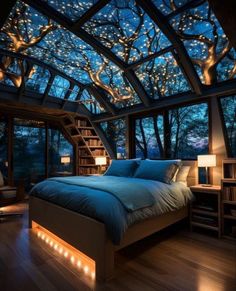 a large bed sitting under a skylight next to a book shelf filled with books