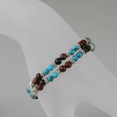 The bracelet is handmade using turquoise and semi precious stone Agate. Turquoise and brown agate is a compatible and cheerful pair. Turquoise provide a cool backdrop for the warm tone of the stone, and neutral silver mediate between the warm and cool hues. The length of the bracelet is 7-8 ¼ inches; 18-21cm. Turquoise, a refreshing and auspicious color. It is calming but still contains a touch of warmth. It is considered the most healing color. Turquoise goes with everything. Jeans, black, brow Turquoise Agate Bracelets As Gift, Brown Gemstone Bracelet Gift, Brown Gemstone Bracelet As A Gift, Brown Gemstone Bracelet For Gift, Brown Gemstone Bracelet Perfect For Gifts, Turquoise Agate Beaded Bracelets Gift, Turquoise Pearl Earrings, Turquoise And Brown, Brown Agate