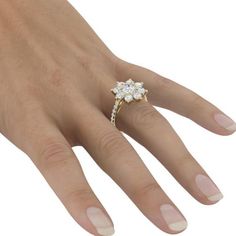 a woman's hand with a diamond ring on it