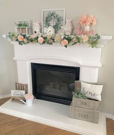 a fireplace decorated with flowers and greenery on the mantel above it is a sign that says welcome spring