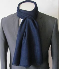 Handsome double lined scarf with fine tassels.Scarf measures 12 inches wide by 70 inches long Classic Solid Color Formal Scarves, Classic Business Scarves For Fall, Elegant Solid Color Winter Scarves, Elegant Blue Scarf For Winter, Classic Fall Business Scarves, Elegant Blue Winter Scarf, Classic Solid Color Winter Shawl, Elegant Wool Scarves For Formal Occasions, Elegant Winter Scarves For Workwear