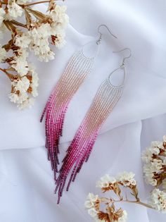 Pink Party Earrings With Tiny Beads, Pink Long Drop Earrings With Dangling Beads, Elegant Pink Earrings With Tiny Beads, Pink Beaded Fringe Earrings For Party, Pink Seed Bead Earrings, Pink Dangling Beads Long Drop Earrings, Elegant Pink Earrings With Beaded Fringe, Pink Beaded Tassel Earrings For Gifts, Pink Hypoallergenic Beaded Dangle Earrings