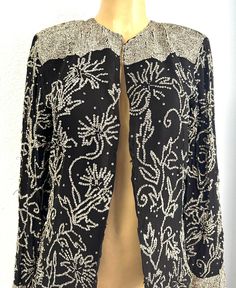 This lace blazer coat is all hand beaded with sequins perfect for parties and special events. Glamorous Embellished Outerwear For Holiday, Glamorous Holiday Embellished Outerwear, Elegant Embellished Festive Outerwear, Elegant Embellished Outerwear For Night Out, Fitted Embellished Outerwear For Party, Embellished Fitted Party Outerwear, Fitted Embellished Party Outerwear, Elegant Long Sleeve Outerwear For Party Season, Spring Party Embellished Outerwear