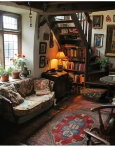 a living room filled with furniture and lots of books