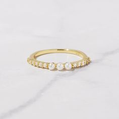 Beautiful pave band with three dainty pearls. So dainty and chic, it looks so cute on its own or stacked with other rings! - - - D E T A I L S - - - * Made of 925 Sterling Silver * THICK plating of 14k Gold or Rhodium * Available in Sizes 6, 7, 8, or 9 * Ring width: 2mm * Will NOT turn fingers green * Nickel-free & Hypoallegenic Made with 100% Pure Love 💜 Ring Sizer- https://www.etsy.com/listing/1240904225/ring-sizer-reusable-ring-sizer-plastic?click_key=f93d1ab266e67efb3e3db4839cb55bfeb500cb3b Three Pearl Ring, Minimalist Rings Simple, Recreate Outfits, Pearl Ring Gold, Minimalist Ear Cuff, Silver Pearl Ring, Eternity Ring Gold, Gold Pearl Ring, Simple Ring