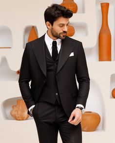 Step out in style with this black 3-piece suit, showcasing peak lapels and a vest with lapels for added charm. T he unique ticket pocket design gives this slim-fit suit a touch of personality, making it ideal for formal occasions. Color: black Material: 70% wool, 27% polyester, 3% elastane Suit includes blazer, waistcoat, & trousers Single-breasted suit (2-button blazer) Lapel type: peak lapels Jacket interior lining option: fully-lined Jacket vent: double vent Fitting: slim-fit Care instruction Blazer Waistcoat, Slim Fit Suit Men, Brown Suit, Facebook Black, Lapel Jacket, Brown Suits, Slim Fit Suit, Fitted Suit, 3 Piece Suits