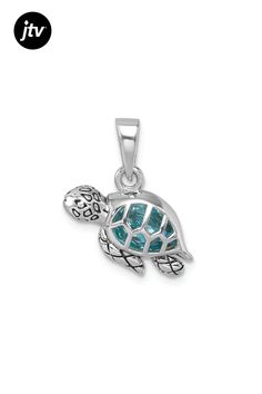 Rhodium over sterling silver polished and antiqued finish swimming turtle pendant with blue crystal. Measures approximately 13/16"L x 5/8"W. Silver Turtle Jewelry, Silver Sterling Silver Turtle Jewelry, Blue Sterling Silver Jewelry With Oxidized Finish, Blue Oxidized Sterling Silver Jewelry, Nickel-free Silver Turtle Jewelry, Swimming Turtle, Turtle Pendant, Antique Finish, Blue Crystals