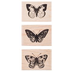 three butterfly rubber stamps with the words hero arts in black and white, on top of each