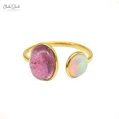 Description Discover your look with our genuine pink tourmaline & opal gemstone ring, which is meticulously crafted in 14k solid yellow gold and set with real pink tourmaline and opal gemstones secured in bezel setting. You can increase your style score. This exquisite double stone ring was handmade with extreme attention to detail and accuracy, giving it a sophisticated and classy appearance. This piece definitely stands out as an accessory because of the eye-catching combination created by the Yellow Gold Round Tourmaline Jewelry, Opal And Pink Tourmaline Ring, Luxury Tourmaline Cabochon Rings, Fine Jewelry Tourmaline In Pink, Pink Tourmaline Cabochon Ring, Cuff Design, Split Shank Ring, Cuff Rings, Split Shank