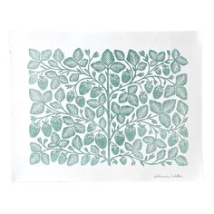 a green and white print with leaves on it