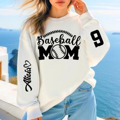 Custom Baseball Mom Sweatshirt with the Name and the Number on Sleeve, Baseball Match T-Shirt, Ball Mom Hoodie, Baseball Player Gift, T029 🌸 Welcome to Pinky Tee Store! We strive to provide you with the best shopping experience possible. Thank you for choosing us!" 👉 Ordering Process: 📸 Thoroughly examine all the available photos. 📏 Select your item's size. 🎨 Choose your preferred color. 🔢 Specify the desired quantity. 🛒 Add the selected item to your cart. 💳 Proceed to checkout to finali Baseball Mom Sweatshirt Ideas, Casual Hooded Sports T-shirt, Casual Raglan Sleeve Sweatshirt With Letter Print, Basic Crew Neck Sports Hoodie, White Raglan Sleeve Sporty Sweatshirt, Sporty Hooded T-shirt With Letter Print, White Casual Sweatshirt With Raglan Sleeves, Sporty White Hooded T-shirt, White Sports T-shirt With Ribbed Cuffs