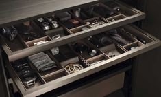 an open drawer with many items in it