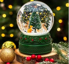 a snow globe sitting on top of a wooden table