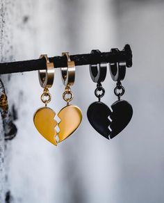 The Heartbreaker Earrings has two hinged hoop earring (20 GA) and is made from high-grade Stainless Steel. Features a 3-D broken heart design and stands 5/8" tall x 3/8" wide x 1/8" thick. Material of Pendant & Earring Base: 316L Stainless Steel 18KT Gold Plated or Rhodium Plated Over Stainless Steel and Finished With a Protective Coating Water, Heat, Sweat Resistant Hypoallergenic (No Green Skin) *Pierced jewelry and earrings are non-returnable items due to hygiene and safety reasons. Pierced Heart-shaped Stainless Steel Jewelry, Heart-shaped Stainless Steel Pierced Jewelry, Heart-shaped Tarnish Resistant Stainless Steel Earrings, Heart-shaped Stainless Steel Tarnish Resistant Earrings, Heart-shaped Stainless Steel Tarnish-resistant Earrings, Metal Hoop Earrings With Heart Charm For Valentine's Day, Heart-shaped Stainless Steel Earrings For Valentine's Day, Valentine's Day Metal Hoop Earrings With Heart Charm, Heart Shaped Stainless Steel Earrings