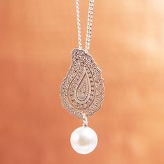 Glowing beautifully a cultured pearl dangles below a sterling silver paisley that is detailed with intricate patterns. Mexican artisan Dalia Pascal designs this pendant necklace which is inspired by eastern iconography. Sterling Silver Teardrop Pendant With Intricate Design, Traditional Silver Teardrop Necklace, Ornate Silver Teardrop Necklace, Traditional Engraved Teardrop Necklace, Bohemian Pearl Drop Pendant Necklace, Ornate Silver Necklace With Pearl Pendant, Elegant Silver Pearl Necklace With Intricate Design, Bohemian Silver Jewelry With Pearl Charm, Traditional Teardrop Large Pendant Jewelry