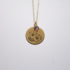 This coin necklace is stamped with the birth flower for each month and is the perfect dainty piece. Add your favorite Identity Mini Gem for an additional touch. Materials: 14k gold fill, Sterling Silver Measurements: 16" chain, 18" chain Pendant: 5/8" coin Gold Birthstone Necklace With Flower Pendant, Gold Birthstone Necklace With Flower Charm, Gold Birthstone Necklace With Flower Pendant And Charm, Yellow Gold Birth Flower Charm Necklaces, 14k Gold Filled Round Pendant Necklace With Birth Flower, 14k Gold-filled Necklace With Birth Flower Round Pendant, Delicate Yellow Gold Charm Necklace With Birth Flower, Delicate Yellow Gold Birth Flower Charm Necklaces, Dainty 14k Gold-filled Birth Flower Charm Necklace