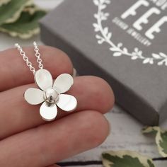 POSTAL DELAYS ARE COMMON DURING DECEMBER AND SADLY I CAN NOT GUARANTEE YOUR ORDER WILL ARRIVE IN TIME FOR CHRISTMAS.    This pretty sterling silver flower pendant necklace has been designed and is handmade by me, completely from scratch in my Sussex UK workshop using traditional silversmithing techniques.   First I create a design which I then transfer to silver sheet.   Then begins the process of carefully piercing out the flower with a very fine saw blade.  After, follows lots of filing and refining until I'm happy with the shape before doming and topping off with a hand-forged silver ball.   The flower pendant measures approximately 1.9cm at its widest point and is supplied on a lovely sterling silver mini rolo chain. Matching flower dangle earrings are available here: https://etsy.me/2 Sterling Silver Birth Flower Necklaces, Delicate Silver Flower Charm Necklace, Silver Delicate Flower Charm Necklace, Nickel-free Sterling Silver Flower Necklace, Dainty Silver Flower Charm Necklace, Silver Flower Charm Necklace With Round Pendant, Dainty Silver Flower Necklace Nickel Free, Unique Flower Pendant Necklaces With Charm, Nickel Free Sterling Silver Flower Necklace