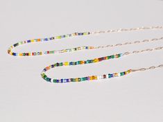 Quirky, modern, and super cool. African glass beads on a 14k Gold Open Link Chain. Available in 14k yellow gold. Made in the USA All CH jewelry is made to order. Please allow up to 10 business days for your item(s) to ship.