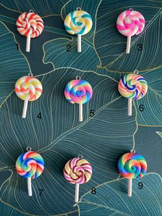 an assortment of lollipops on a green background