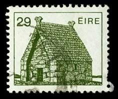 a stamp with a small house on it's front and the word fire written in green