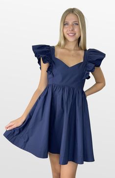 Definitely the plan. This color-match babydoll dress mixes trend and comfort. The fitted lined bodice has an open back that double ties for the perfect fit. The shoulder ruffle sleeves are just the right touch with a full skirt that gives plenty of movement and comfort. Look your best on Gameday! Color-Navy (Also Available in Crimson, Purple, and Burgundy) 100% Cotton Lining- 100% Polyester Chic Dresses With Flutter Sleeve And Ruffled Skirt, Chic Dresses With Ruffled Skirt And Flutter Sleeve, A-line Dress With Pleated Sleeves For Brunch, Chic Lined Dresses With Ruffled Straps, Chic Dresses With Lined Ruffled Straps, Chic Dresses With Ruffled Straps And Lined, Summer A-line Puff Sleeve Dress With Ruffles, Lined Dress With Ruffled Straps For Date Night, Ruffle Sleeve Mini Dress For Brunch