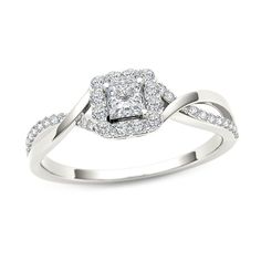 a white gold ring with a square diamond center surrounded by small round brilliant cut diamonds