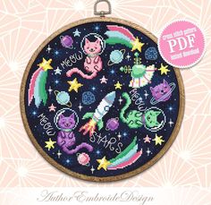 a cross stitch pattern with cats on the moon and stars in it, as well as an