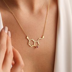 Looking for a unique and special birthstone serotonin necklace that celebrates the chemical that helps regulate mood, emotion, and feelings of happiness? Look no further than thisScience Jewelry, Chemistry Pendant, Molecule Necklace, Serotonin Necklace! Made with polished silver, rose gold, and gold, this dainty and delicate bracelet is perfect for everyday wear. Whether you're seeking a gift for a science lover or for yourself, this is a beautiful way to represent the power of serotonin. Best u Serotonin Necklace, Serotonin Molecule, Initial Birthstone Necklace, Molecule Necklace, Family Birthstone Necklace, Rose Gold And Gold, Science Jewelry, Science Lover, Letter Necklace