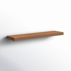 a wooden shelf mounted on the wall