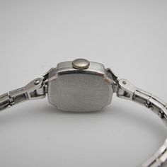 "For sale: (1) g123 14k White Gold Women's Diamond Elgin Watch PLEASE READ ENTIRE DESCRIPTION BEFORE PURCHASING Pre-owned item. Good condition. Please see pictures for details. Sold as is, as seen on pictures. This beautiful ladies Elgin Art Deco watch contains 62 diamonds, all of which are round cut. It is stamped. Specifics: 14k White gold Diamonds: .86TCW Mechanical Length: 5.5 inches Case size with crown: 15.9 mm Lug width: 4mm Please be 100% sure of your purchase before buying, as we do not Elegant Engraved White Gold Watch Accessories, Elegant Collectible Watch With Rectangular Dial, Vintage Platinum Diamond Watch With Polished Finish, Hallmarked Diamond Watch For Evening, Round Shape, Timeless Platinum Jewelry And Watches With Polished Finish, Silver Platinum Diamond Watch Gift, Silver Platinum Diamond Watch Perfect For Gift, Silver Platinum Diamond Watch For Gift, Hallmarked Diamond Watch For Evening