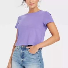 This 100% Cotton Short Sleeve T-Shirt In A Pretty Lavender Purple Color Is Slightly Cropped; This Shirt Is Brand New, Never Been Worn. Super Soft! Size Large Approx. Measurements When Laying Flat: Pit To Pit - 20” Shoulder To Hem - 20” This Qualifies For My 3 For $30 Deal. Add This Item To Your Bundle With 2 Other Items That Also Qualify And I Will Offer The $30 Deal And Discount The Shipping! If You Have Any Questions At All, Please Feel Free To Message Me. Thank You For Shopping My Closet! Don