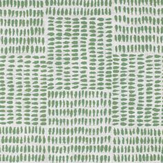 a green and white pattern on fabric