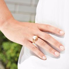 This contemporary ring has a striking and unique design. The handmade ring is set in 18ct Gold Vermeil on solid Sterling Silver and features a large white Freshwater Pearl. The striking design has a distinctive setting, which creates the illusion of a floating pearl. A loop is set around the base of the pearl. This original designer piece has been handmade by our artisan craftsmen using only the finest precious metals and authentic Freshwater Pearls. All our jewellery is ethically made according Pearl Ring Designs Silver, Pearl Ring Designs Unique, Big Pearl Ring, Pearl Ring Design, Natural Pearl Ring, Silver Pearl Ring, Ring Pearl, Freshwater Pearl Ring, Big Pearl