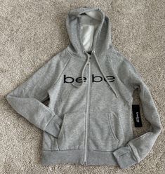 BEBE SPORT GRAY LOGO HOODED SWEATSHIRT  SIZE SMALL NEW WITH TAGS Gray Fleece Sweatshirt For The Gym, Gray Crew Neck Hoodie For Sportswear, Gray Crew Neck Hoodie For Sports, Gray Crew Neck Sports Hoodie, Gray Crew Neck Hoodie Sportswear, Gray Crew Neck Sportswear Hoodie, Gray Fleece Sweats With Double-lined Hood, Gray Double-lined Hooded Top For Loungewear, Gray Hooded Sweatshirt With Logo Print