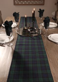 Make your holiday table stand out with the classic Black Watch tartan table runner. Its timeless navy, green, and black plaid design adds a sophisticated touch to your festive table setting, while also creating a cozy, relaxed feel for your country home. Perfect as a striking accent for your holiday dishes or as a stylish runner on your mantle, this versatile piece brings elegance and warmth to any décor. The tartan table runner is made of polyviscose fabric with a coordinating rolled hem edging Scottish Christmas Table Settings, Black Watch Plaid Christmas, Tartan Christmas Decorations, Air Force Families, Festive Table Setting, Holiday Dishes, Canadian Maple Leaf, Black Watch Tartan, Stewart Tartan