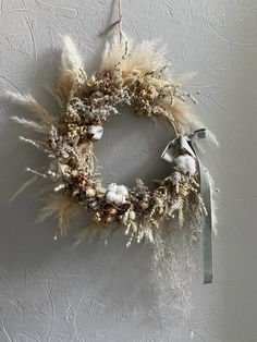 a dried wreath hanging on the wall