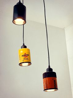 three light fixtures hanging from the ceiling in a room