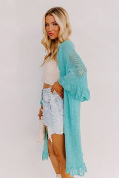 Relax in the summer evening breeze with this cute turquoise cardigan featuring lightweight knit material, oversized half sleeves, ruffle trim detailing, and a draped open front silhouette that falls into a straight mid-calf length hemline! Measurements S : Bust 46", Hip 44", Length 38", Sleeve Length 19", Waist 44". M : Bust 48", Hip 46", Length 39", Sleeve Length 19", Waist 46". L : Bust 50", Hip 46", Length 39", Sleeve Length 19.5", Waist 46". Flowy V-neck Cardigan For The Beach, Chic Beach Cover-up Cardigan For Beach Season, Spring Knit Cover-up For Day Out, Lightweight Cardigan For Beach In Fall, Summer Casual Cover-up For Layering, Casual Wrap Cardigan For Beach Cover-up, Spring Beach Cover-up Duster Open Front, Summer Long Sleeve Knit Cover-up, Long Sleeve Knit Cover-up For Summer