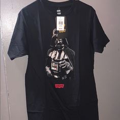 Darth Bader T-Shirt By Levi’s. Size Medium. Brand New With Tags Levi's Short Sleeve T-shirt With Letter Print, Levi's Short Sleeve Letter Print T-shirt, Levi's Short Sleeve T-shirt With Text Print, Levi's Crew Neck T-shirt For Streetwear, Levi's Graphic Tee For Streetwear, Levi's Black Graphic Print Top, Levi's Black Short Sleeve T-shirt, Levi's Black Casual T-shirt, Levi's Black Short Sleeve Tops